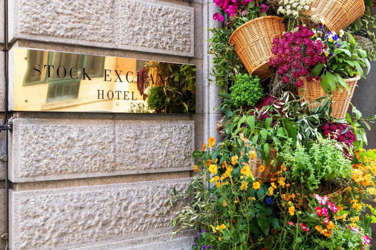 a bunch of flowers on the side of a building at Stock Exchange Hotel, Manchester, Autograph Collection in Manchester